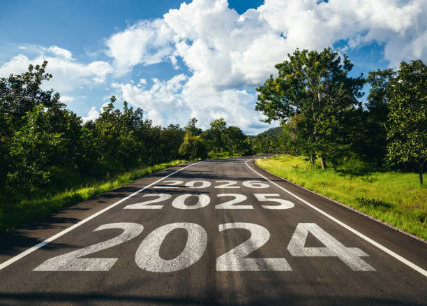 New year 2024 to 2026 written on the road in the middle of asphalt road, Planning of new year concept.